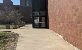 Sidewalk leading to the barrier-free entrances in Knox and Norton Halls. 
