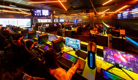 students gaming in the arena at Level Up. 