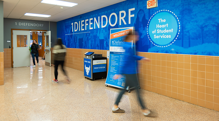 Students walking past the 1Diefendorf entrance. 