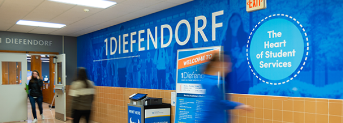 Students walking past the 1Diefendorf entrance. 