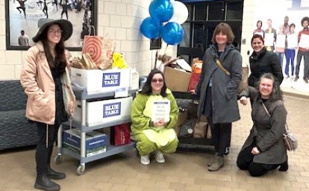 Volunteers drop of food donations collected at UB Business Day 2023 for the Blue Table Food Drive. 