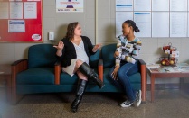 A student and an advisor talking. 