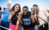 Students giving the horns up sign. 