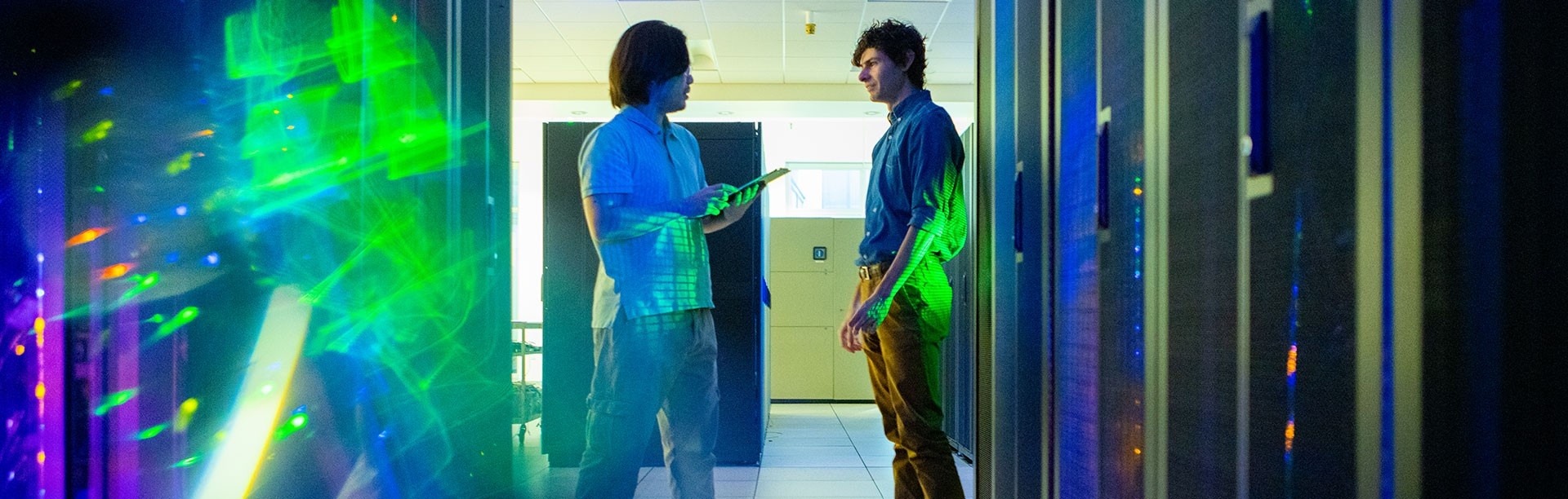 Student and faculty member in a server room. 