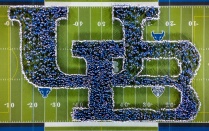 Aerial view of student creating the UB logo using people. 