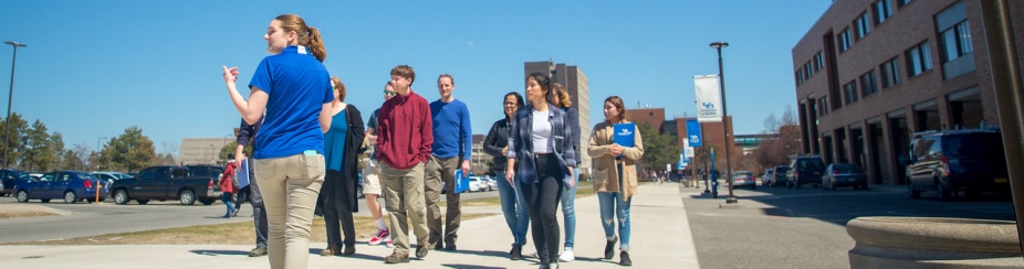 Tour guide leading a group of visitors on North Campus. 