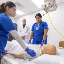Students participate in a patient death simulation training through the School of Nursing in Wende Hall in May 2023. 