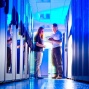 People talking in a data server room. 