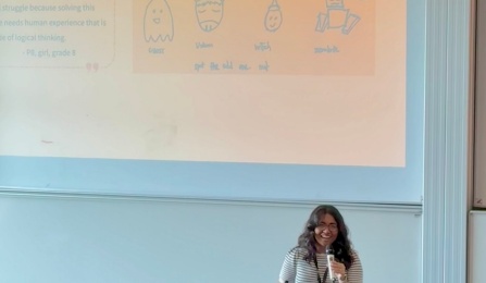 A student delivers a presentation to a room at Interaction Design and Children Conference. 