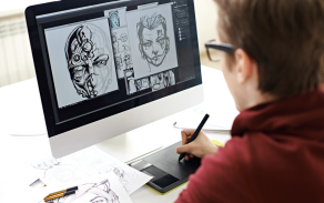 A student works draws an image on a computer. 