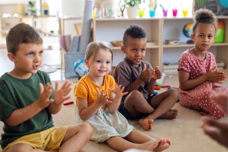 DO NOT USE, MUST BUY THIS IMAGE Pre-school children in a class sitting on the floor.