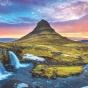A colorful sunset over a mountain in Iceland, one of the travel locations for this coming year. 