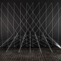 Installation by Lydia Okumura of glass on the ground stretching out white lines towards the wall forming triangular forms overlapping. 