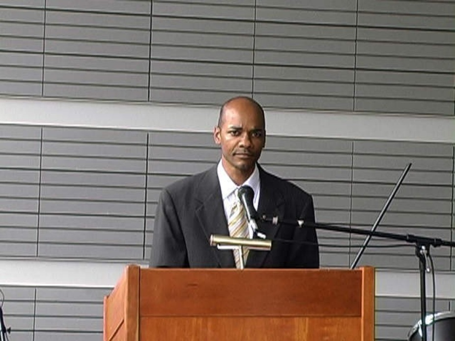 Still image of a video by Rodney McMillian casting himself as politician. 