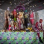 Photography of installation with various patterned clothing on mannequins. 
