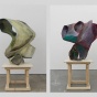 Sculptures by Ernesto Burgos of two different abstract forms on the wooden stool. One on the left being in shades of green and right with range of purple with turquoise. 