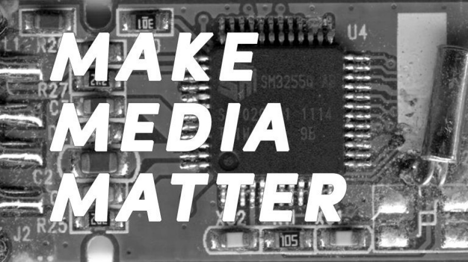 Horizontal black and white image of computer hardware with white lettering on saying "MAKE MEDIA MATTER". 