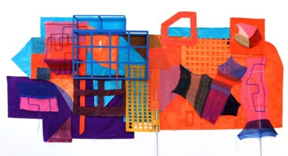 A photo of an abstract painting. The canvase is a long rectangular shape with parts jutting out. Abstract forms cover the inside including grids and geometric shapes. 