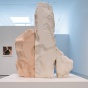 Photo of Philip Pavia exhibition installation with drawings on the wall and three small sculptural studies on pedestals in the middle of the gallery. 