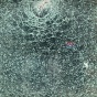 A photograph of tempered glass which has chattered but is still holding together. 