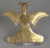 A small sculpture of a gold eagle. 