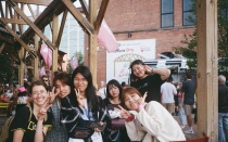 Group of Korean students at outdoor event at Larkin building. 