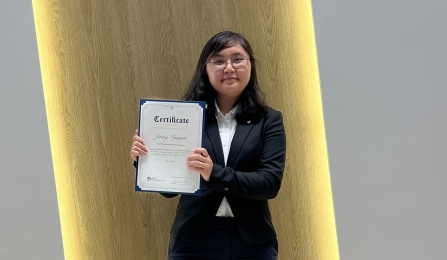 Jenny Nyugen displays her certificate of participation at conclusion of the 2023 Korea America Student Conference. 