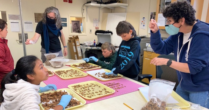 Dr. Caroline Funk and Dr. Virginia Hatfield mentoring culture campers during fish bone sampling in the MOTA lab, Dutch Harbor. August 2021. Photo by Nicole Misarti, courtesy of the Museum of the Aleutians (MOTA). 