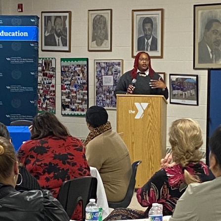 Jillian Hanesworth, the Poet Laureate Emeritus of Buffalo, at the podium for event marking the 70th anniversary of Brown v. Board of Education (BOE). 