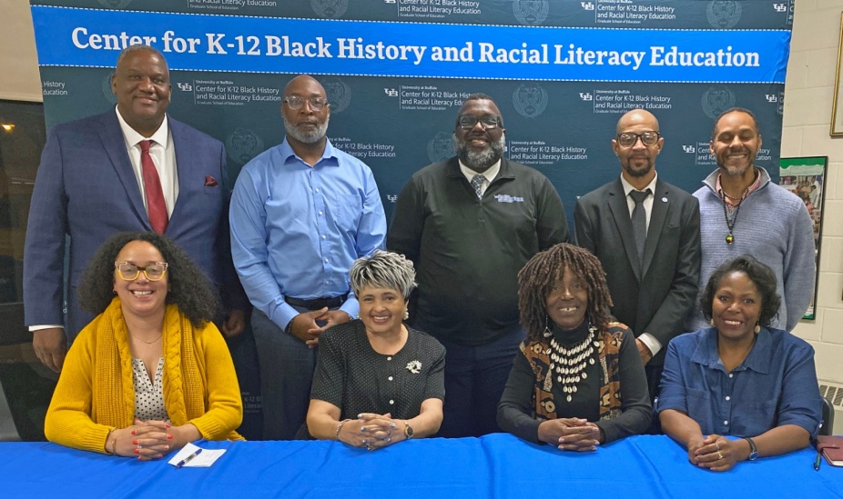 November 7, 2024: Group photo at the event marking the 70th anniversary of Brown v. Board of Education. Pictured, from left, seated: Graduate Fellow Abigail Henry, Panelists Donette Ruffin, Kathleen “Kathy” Franklin Adams, and Nanette Massey. Standing: Hon. Terrance Heard, Panelist Mario Workman, Organizer LaGarrett King, Moderator Anthony White II, and Discussant Marcus Watson. 
