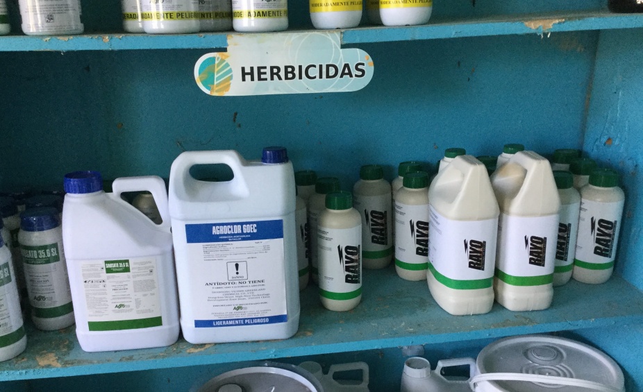 Photo: Herbicide stock at a corner agrochemical shop in the Dominican Republic. Generic glyphosate has flooded low- and middle-income countries, where use has expanded and concentrations have increased. Photo courtesy of Marion Werner, 2019. 
