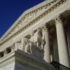 The marble sculpture, Authority of Law, appears below the inscription, EQUAL JUSTICE UNDER LAW, on the west entrance of the U.S. Supreme Court building. Photograph courtesy of CC BY-SA 3.0, Matt H. Wade. 