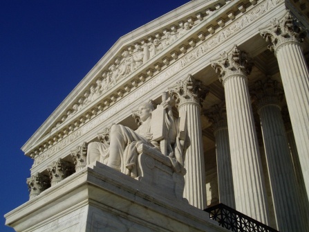 The marble sculpture, Authority of Law, appears below the inscription, EQUAL JUSTICE UNDER LAW, on the west entrance of the U.S. Supreme Court building. Photograph courtesy of CC BY-SA 3.0, Matt H. Wade. 