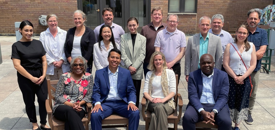 Participants gather for a group portrait, June 7, 2025. Pictured from left, standing: Myah Meyerhoefer, Julia Hall, Lisa Laplante, Min Cho, Federico Gaitan, Gvantsa Dolbaia, Joshua Coene, David Mendeloff, Eric Wiebelhaus-Brahm, Andres Molina-Ochoa, Alice Panepinto, Max Pensky; seated: Athena Mutua, Jorge Luis Fabra-Zamora, Tara Melish, Bonny Ibhawoh. 