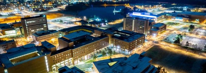 Aerial photo of North Campus taken at night in December 2021. Baldy Hall, Lockwood LIbrary and Clemens Hall are centered. Photographer: Douglas Levere. 