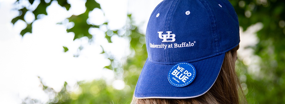 UB student wearing a UB branded hat. 