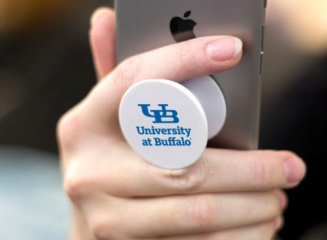 A cellphone pop-socket with the UB Master Brand mark. 