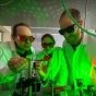 UB faculty in a lab performing an experiment. 