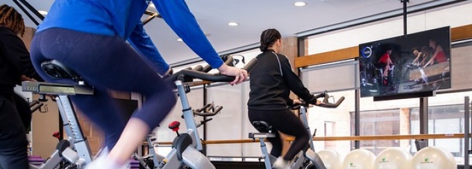 Students attend group cycling classes with ResFit, in the residential fitness center at Ellicott Complex (Richmond Hall). 