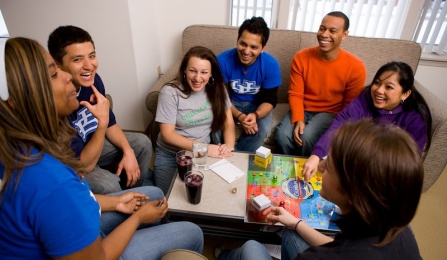a group of students playing a board game. 