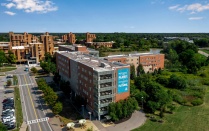View of Greiner Hall across Lake LaSalle. 