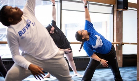 Students taking a yoga class at University at Buffalo. 