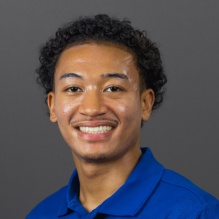 Headshot of Messiah Mumin. 