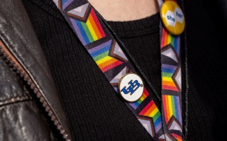 LGBTQ flag lanyard with UB pins on it.