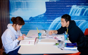 Two students studying together at a table. 