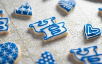 Blue cookies shaped like the UB logo and hearts. 