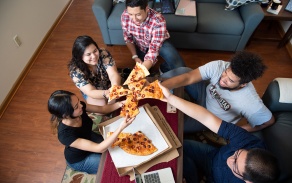 Students sharing an IncrediBull pizza. 