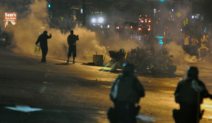Police officers using tear gas during the first wave of the Ferguson unrest. Ferguson Day 6, Picture 44. Created: August 17, 2014. 
