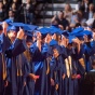 UB graduates in cap and gowns during commencement. 