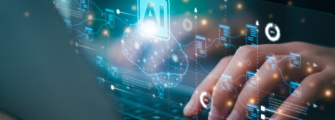 A closeup of a person typing on a computer with AI graphical imagery overlayed on the keyboard and hands signifying the use of AI in writing. 